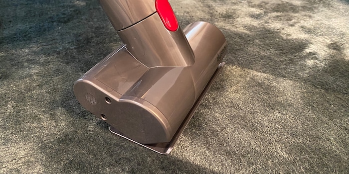 After treating the stain on the carpet, vacuum it up to remove it!