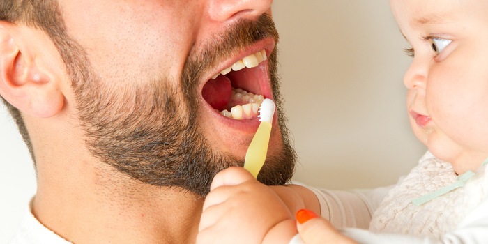 It is worth getting the toddler playfully accustomed to brushing their teeth at an early age.